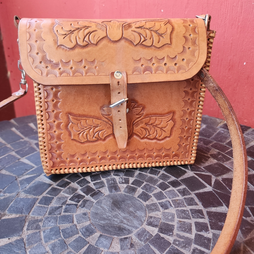 Elegant Brown Crossbody Bag with Intricate Detailing